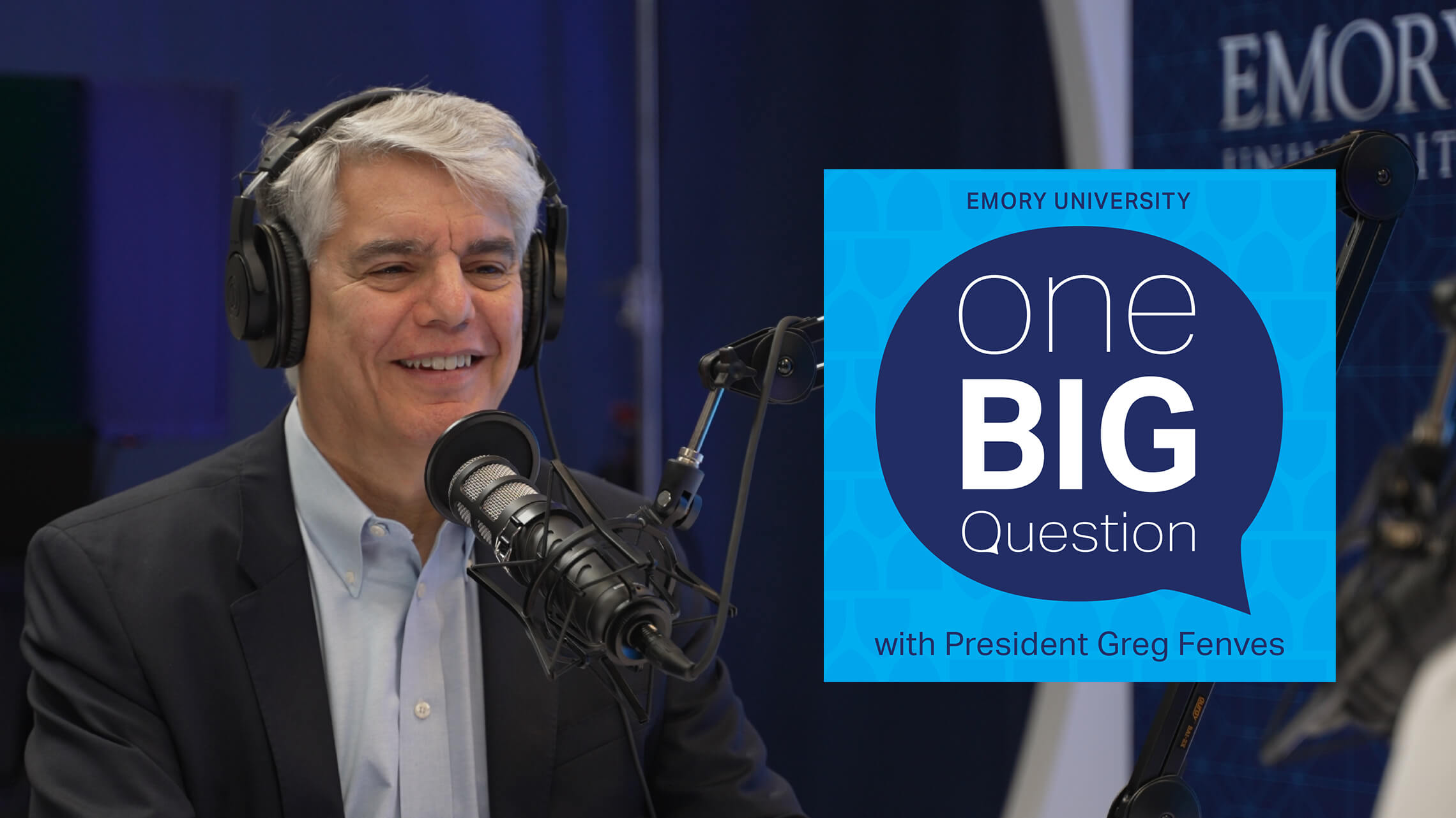 President Fenves smiling in front of a radio mic with One Big Question graphic to the right of him