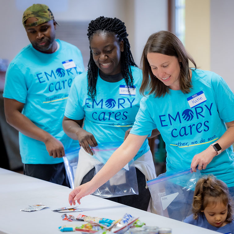 participants of Emory Cares events set out volunteering materials