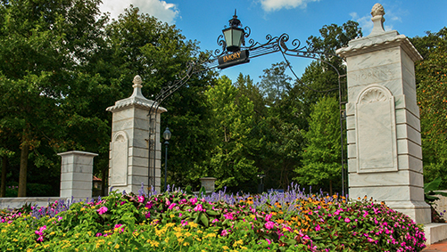 main gate with spring flowers in front
