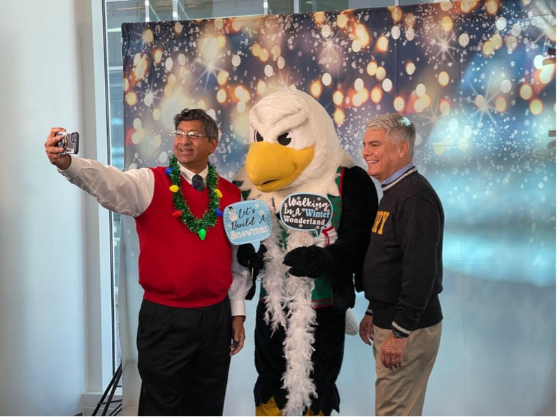 Emory Provost Ravi Bellamkonda takes a selfie portrait with Emory's mascot Swoop and President Gregory L. Fenves